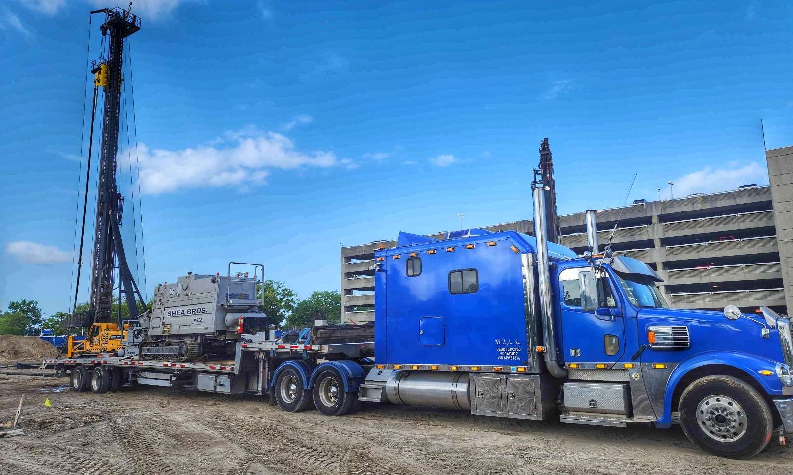 Concrete machinery hauled on stepdeck trailer