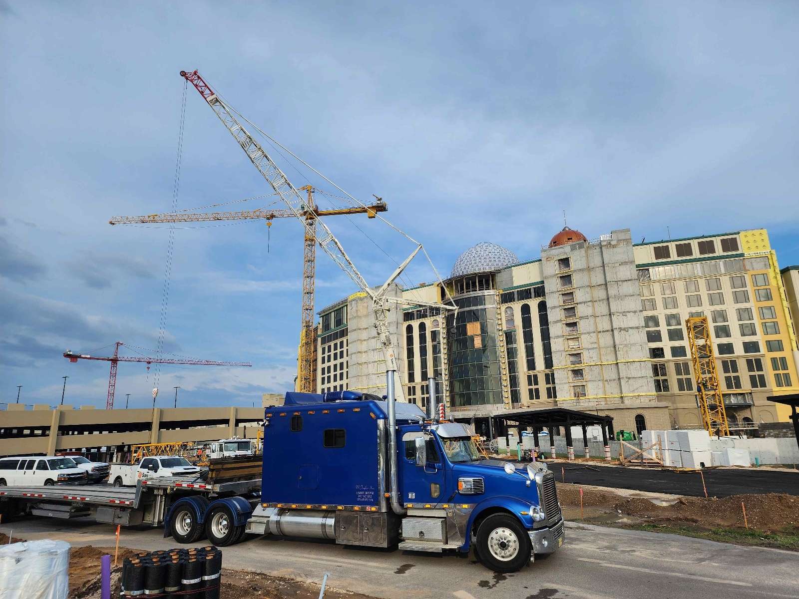 Construction equipment transported on stepdeck trailer